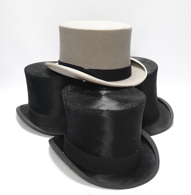 Three gentlemen’s black silk top hats and a similar grey top hat and box. Condition - grey hat good, others poor